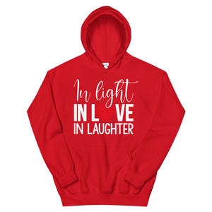 Sudadera con capucha unisex "EN LA LUZ, EN EL AMOR, EN LA RISA"